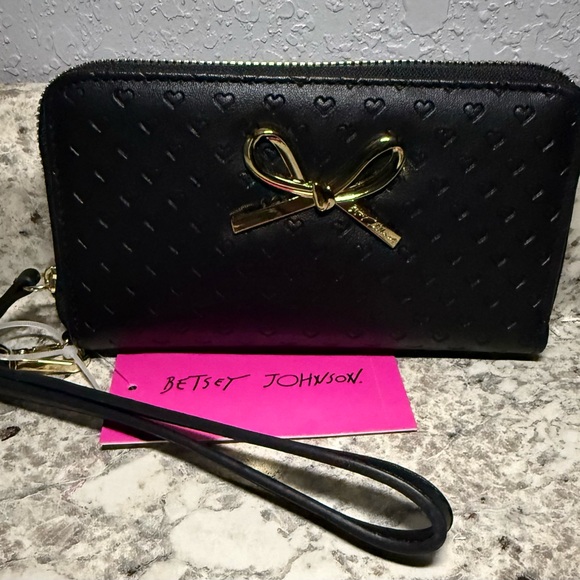 Betsey Johnson Handbags - Betsey Johnson Black Wristlet with Gold Bow